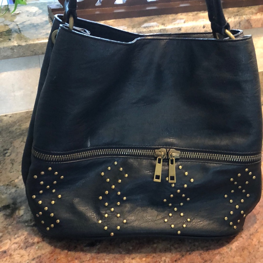 Woman’s black studded bag